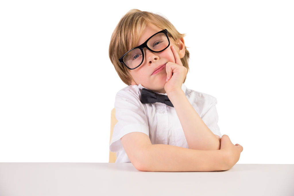 Student wearing glasses and bow tie on white background